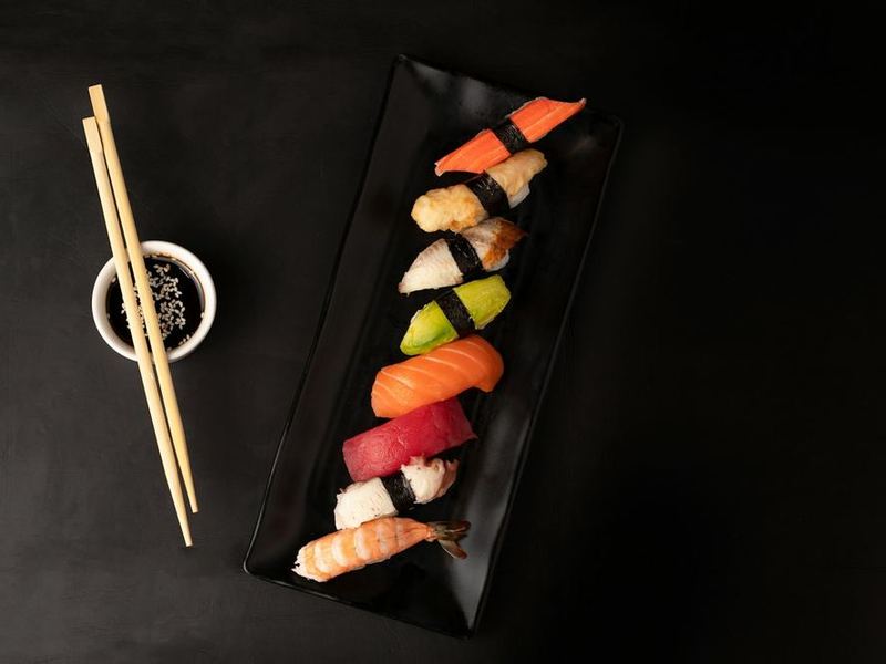 Sashimi and nigiri on slate