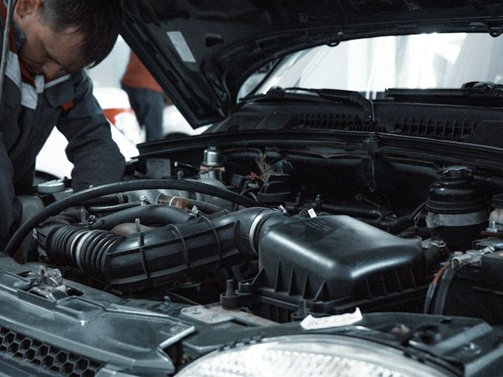 Mechanic checking a car engine